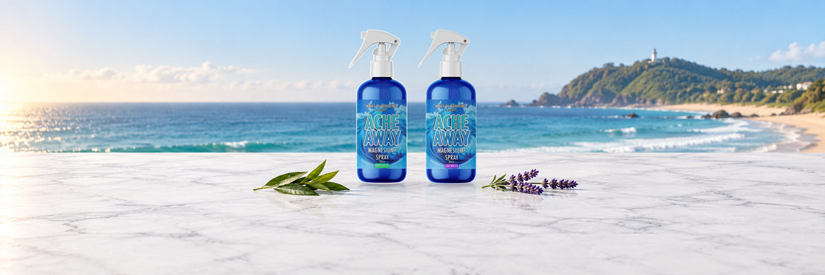 Ache Away magnesium body spray in Lemon Myrtle and Lavender on marble overlooking Byron Bay