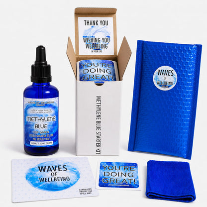 Waves of Wellbeing Methylene Blue Starter Kit unboxed — 100ml bottle, bubble mailer, spill mat, microfibre cloth and welcome cards