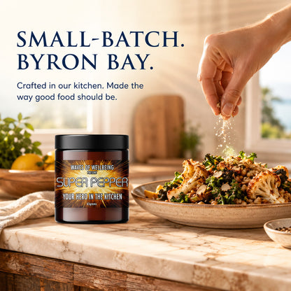 Waves of Wellbeing Super Pepper being sprinkled over roasted vegetables and grains — crafted in our kitchen in Byron Bay